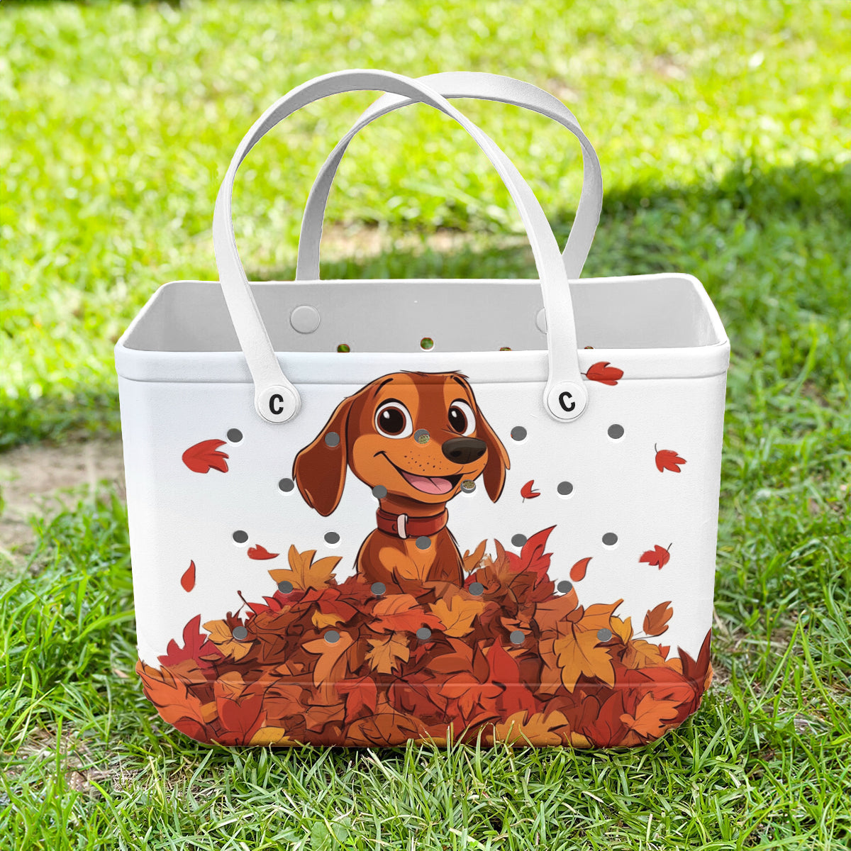 Ceeprints Cee™ Bag Puppy with a pile of autumn leaves