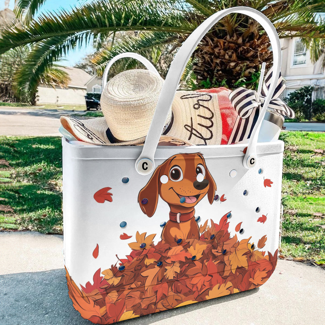Ceeprints Cee™ Bag Puppy with a pile of autumn leaves