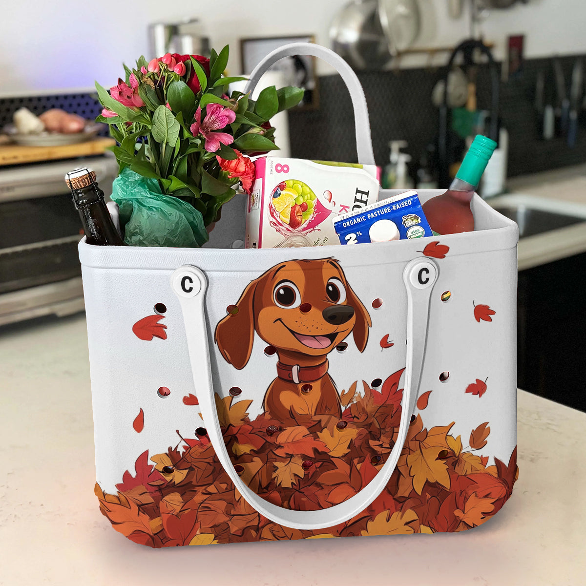 Ceeprints Cee™ Bag Puppy with a pile of autumn leaves