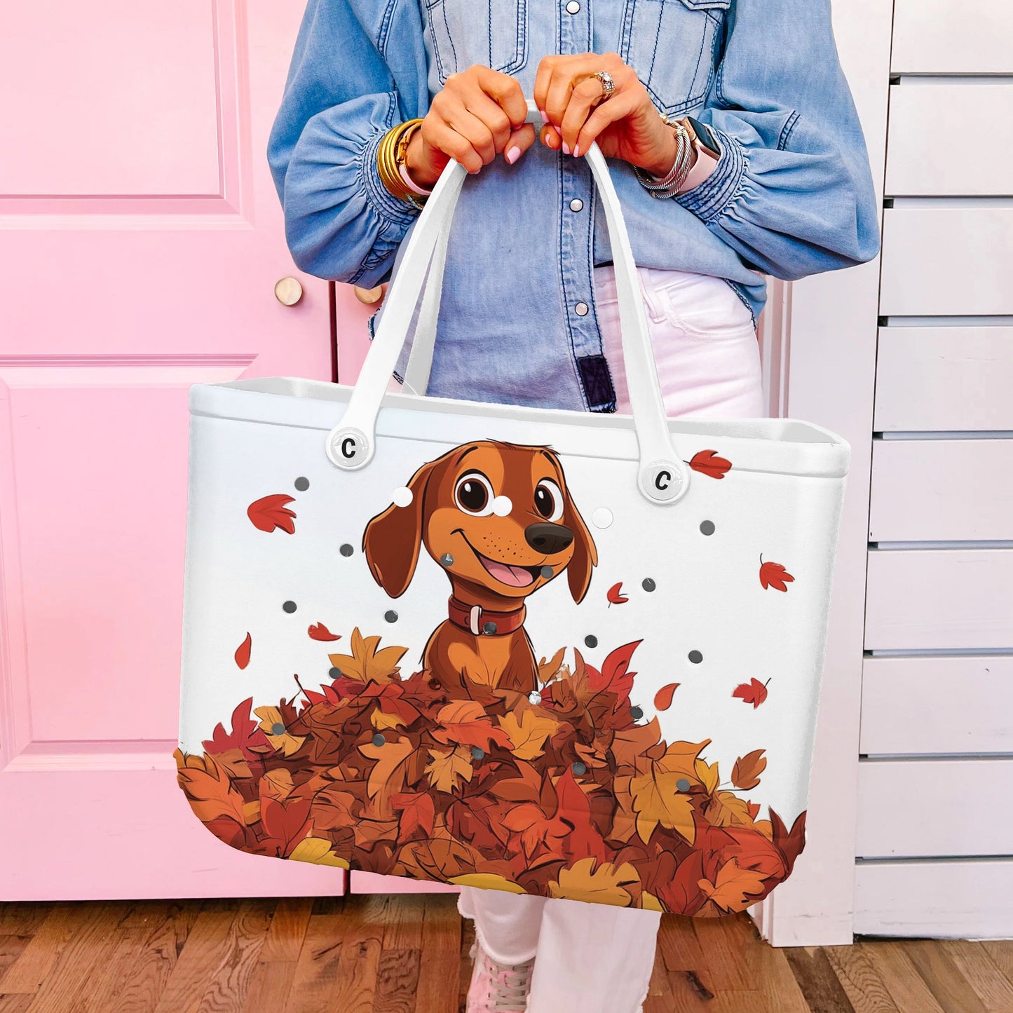 Ceeprints Cee™ Bag Puppy with a pile of autumn leaves