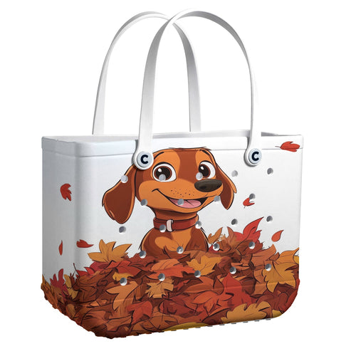 Ceeprints Cee™ Bag Puppy with a pile of autumn leaves