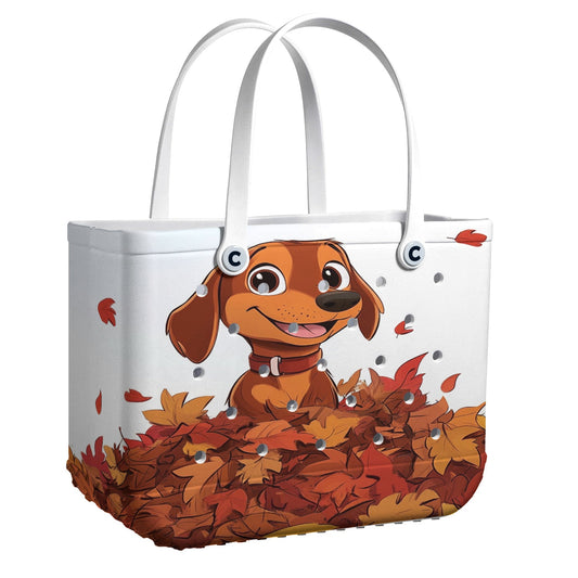 Ceeprints Cee™ Bag Puppy with a pile of autumn leaves